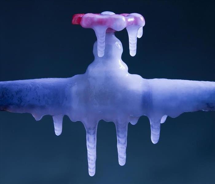 an outdoor pipe faucet that is frozen